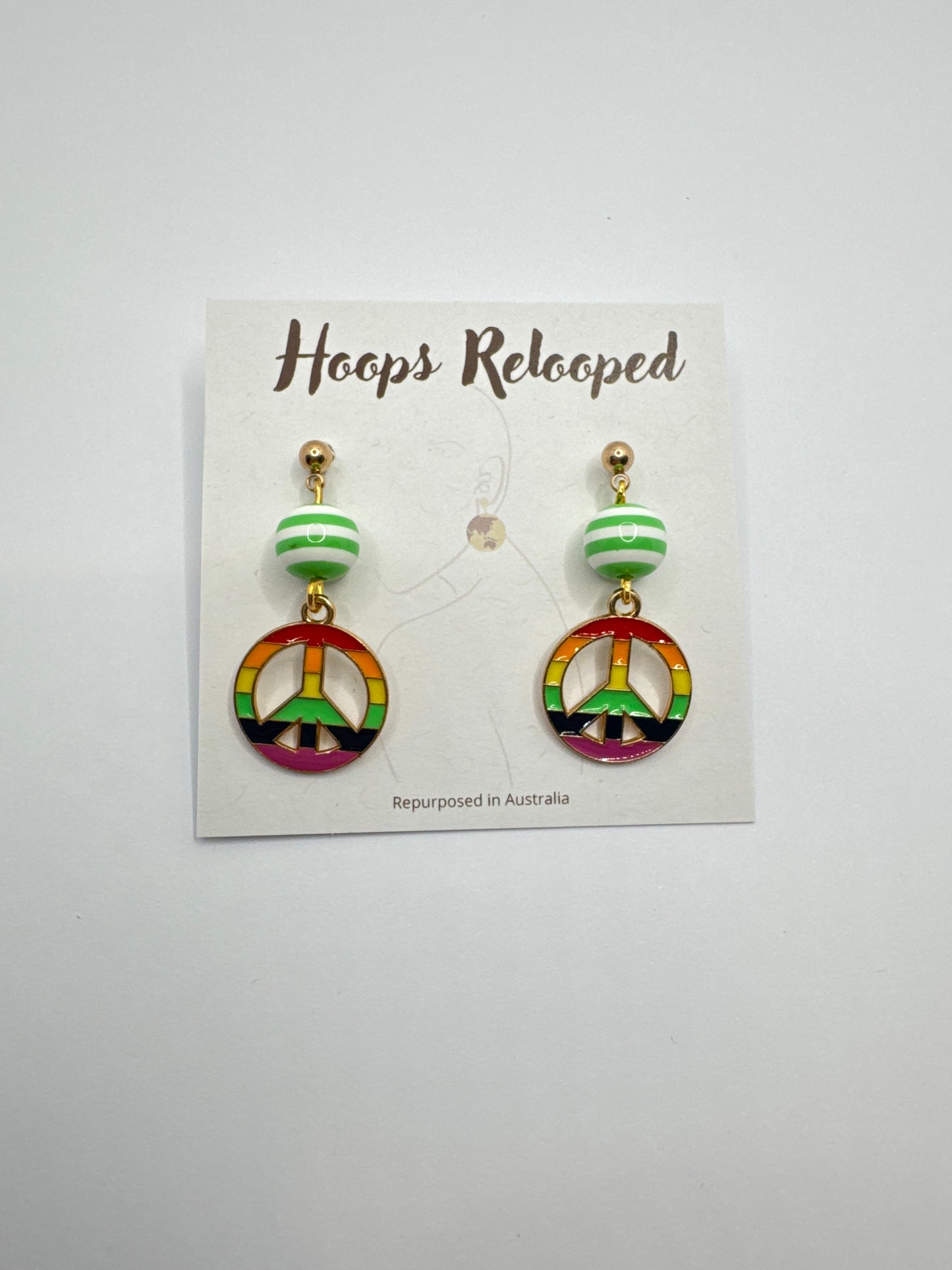 Green and rainbow peace signs