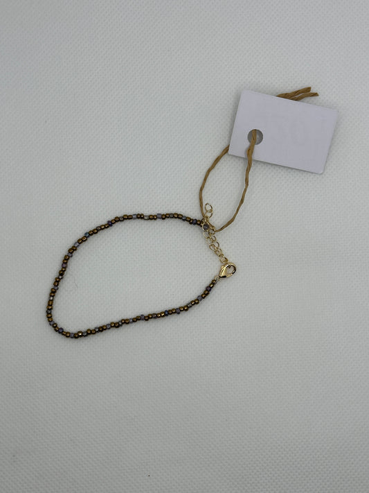 Purple and gold bracelet