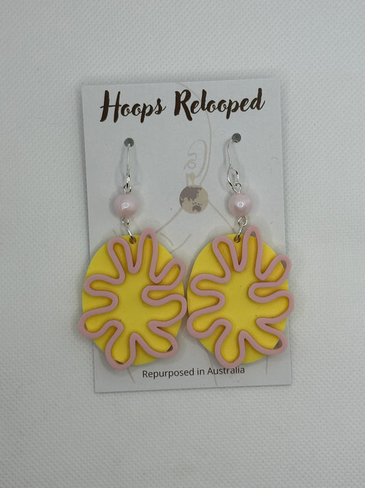 Pastel yellow and pink swirls