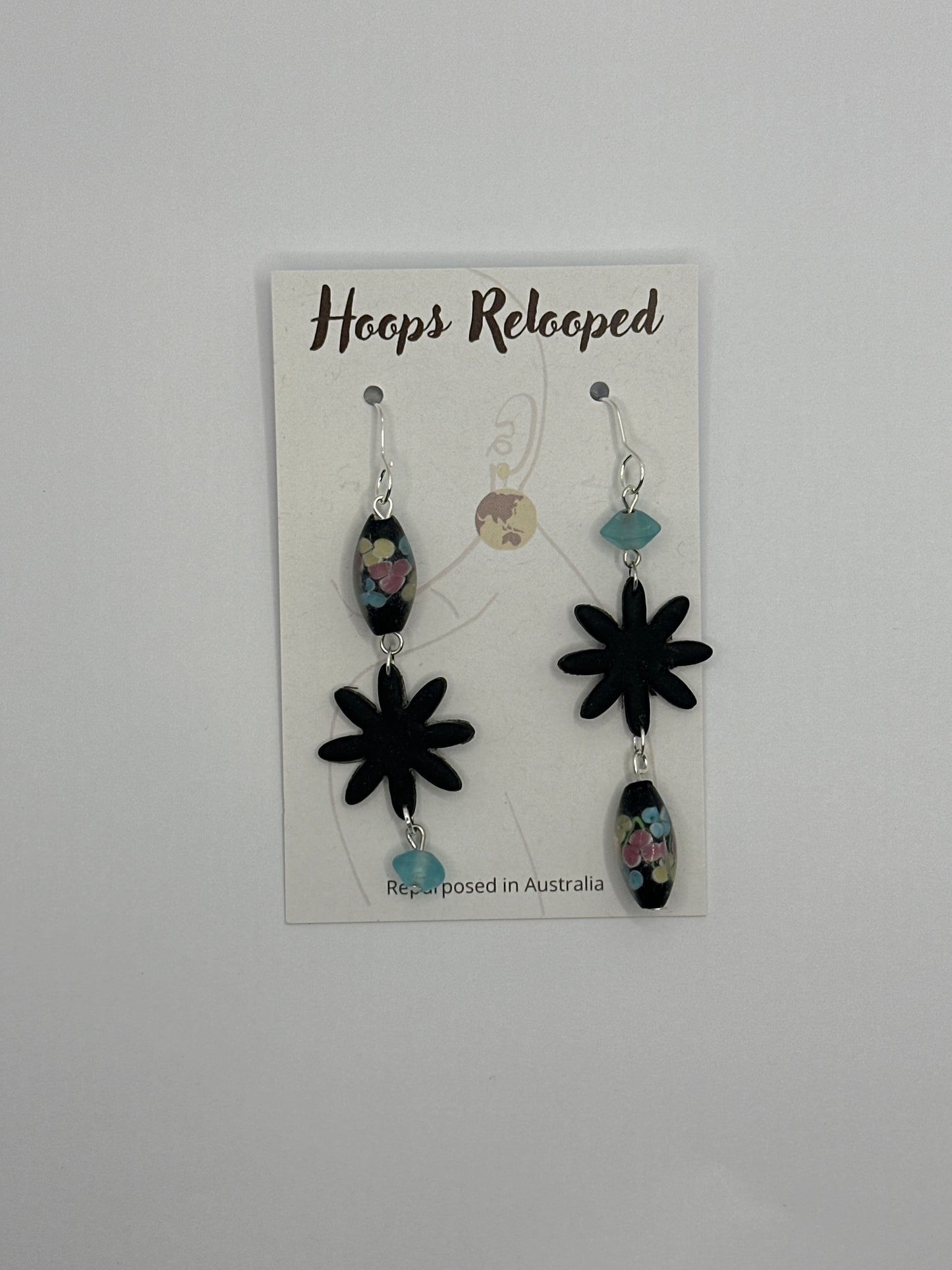 Black asymmetric floral drops