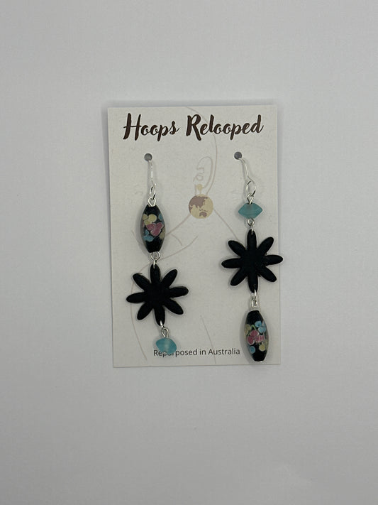 Black asymmetric floral drops