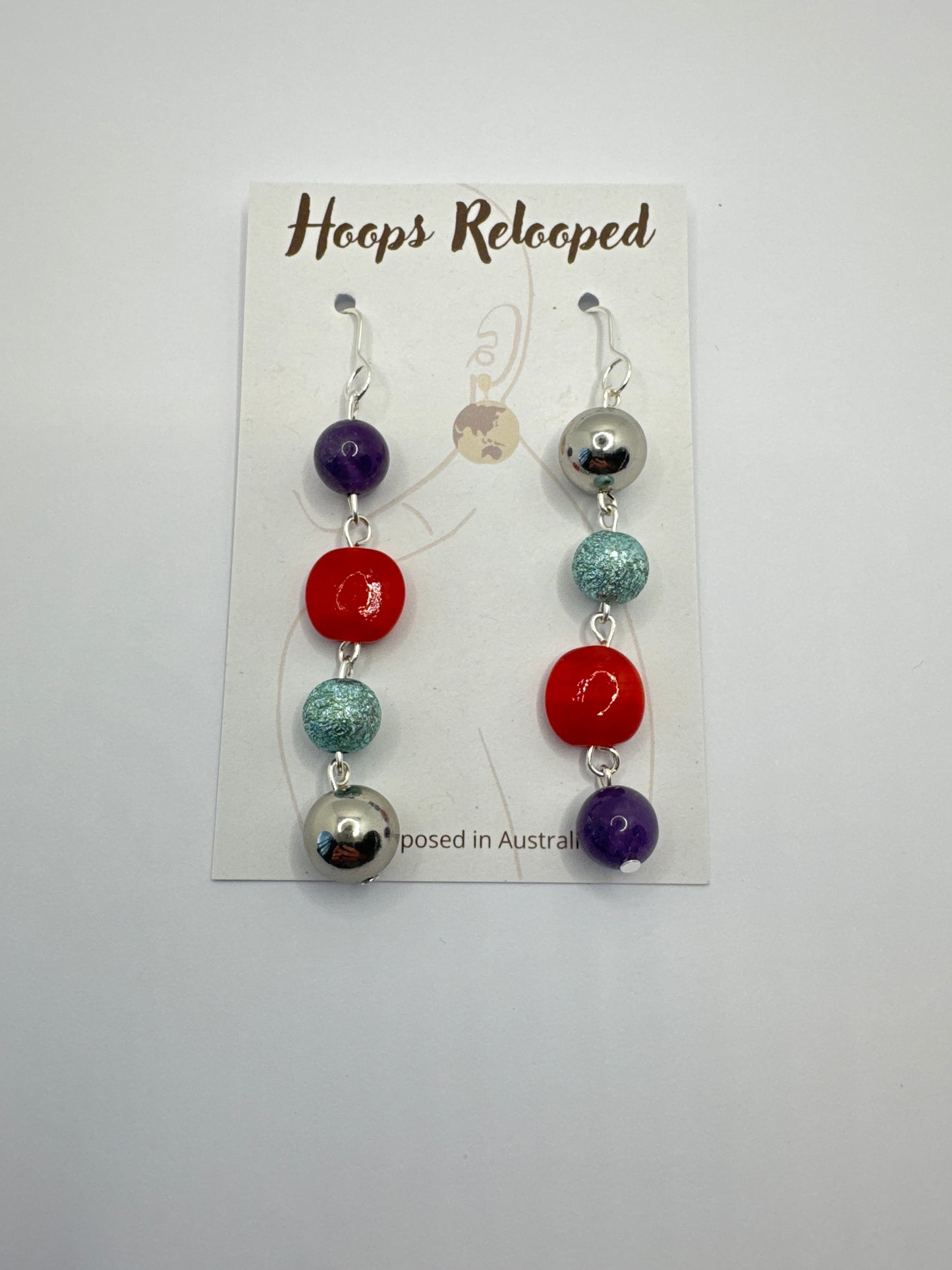 Purple, red, aqua and silver balls