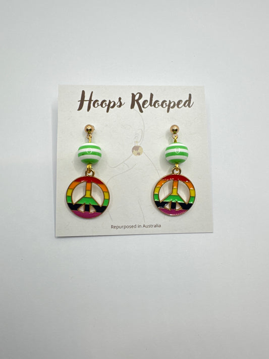 Green and rainbow peace signs